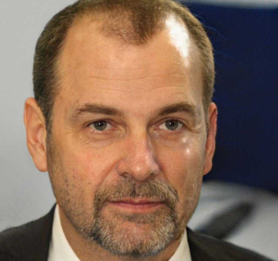 Professional headshot of budget variance analysis expert